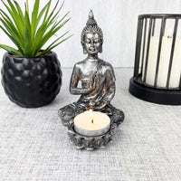 Silver Effect Buddha Candle Holder with candle holder and black planter