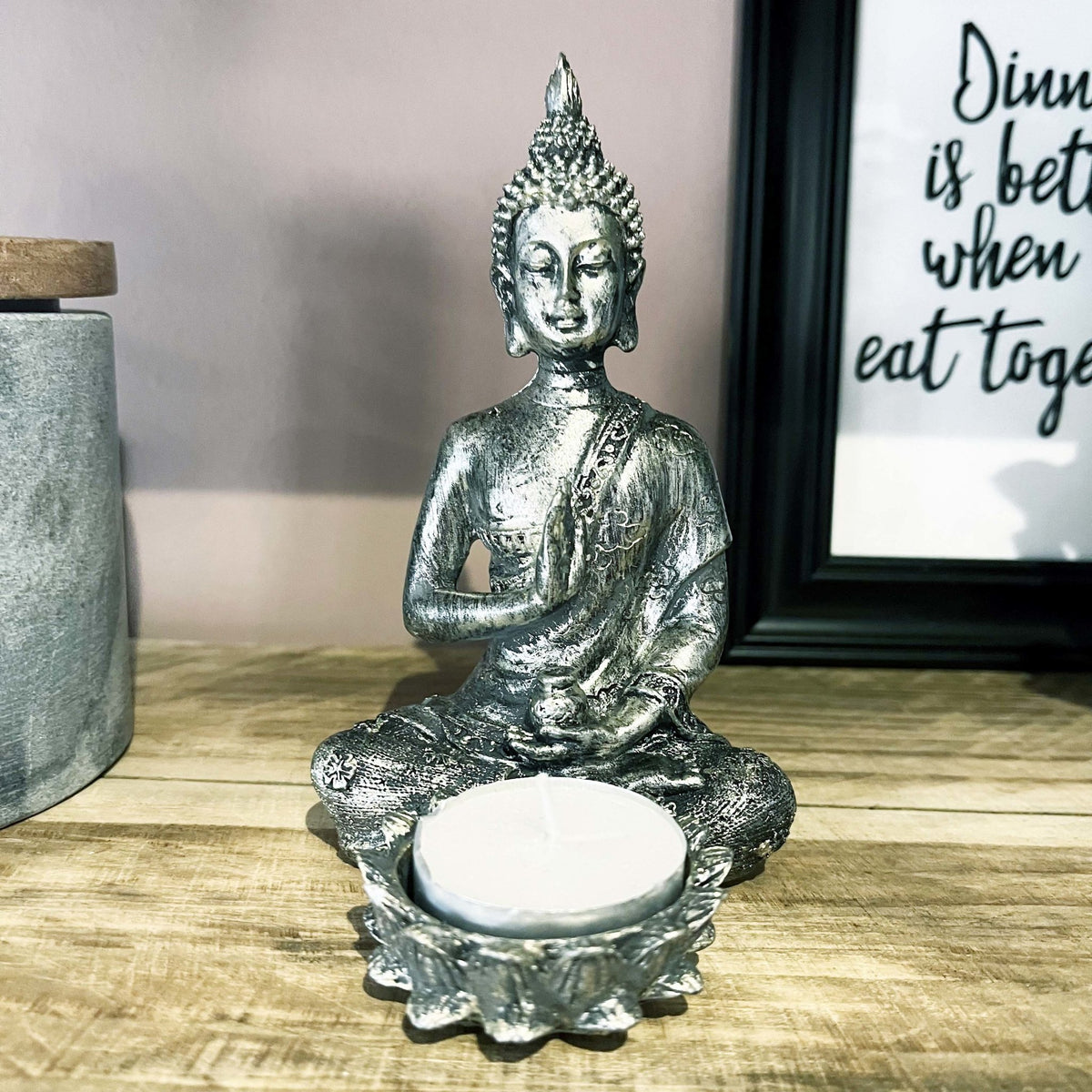 Silver Effect Buddha Candle Holder on wooden kitchen shelving