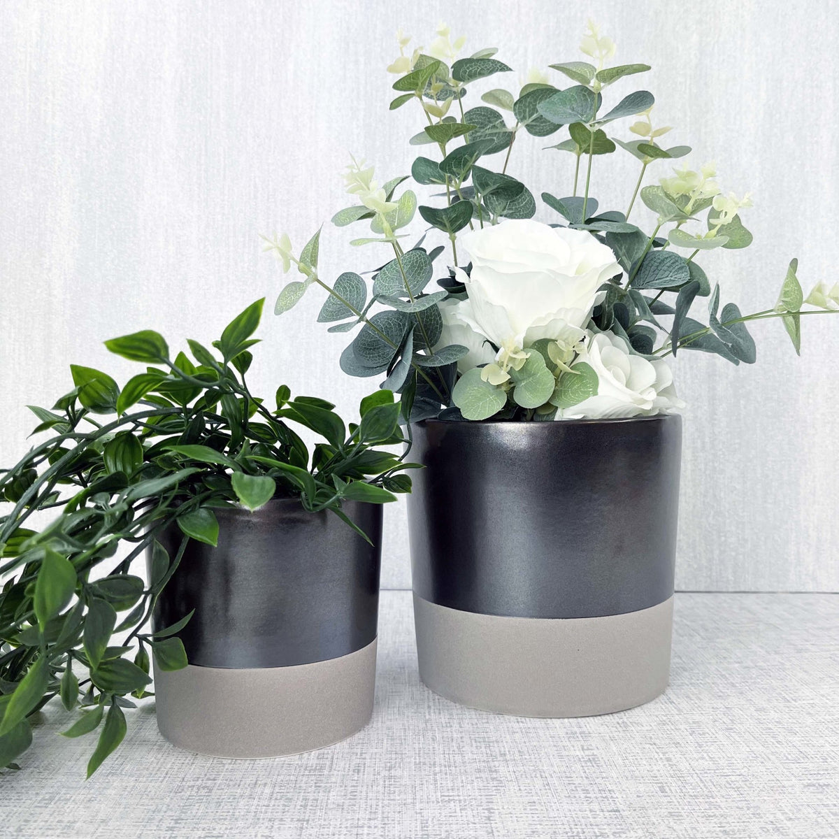 Terra Grey Metallic Style Planters with flowers and greenery in