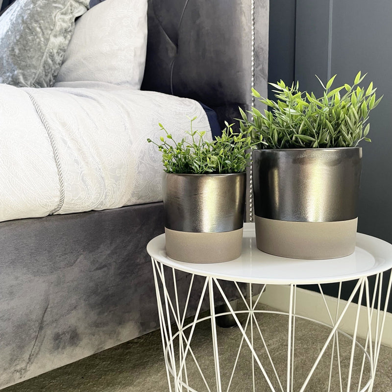 Terra Grey Metallic Style Planters with flowers on white table in bedroom