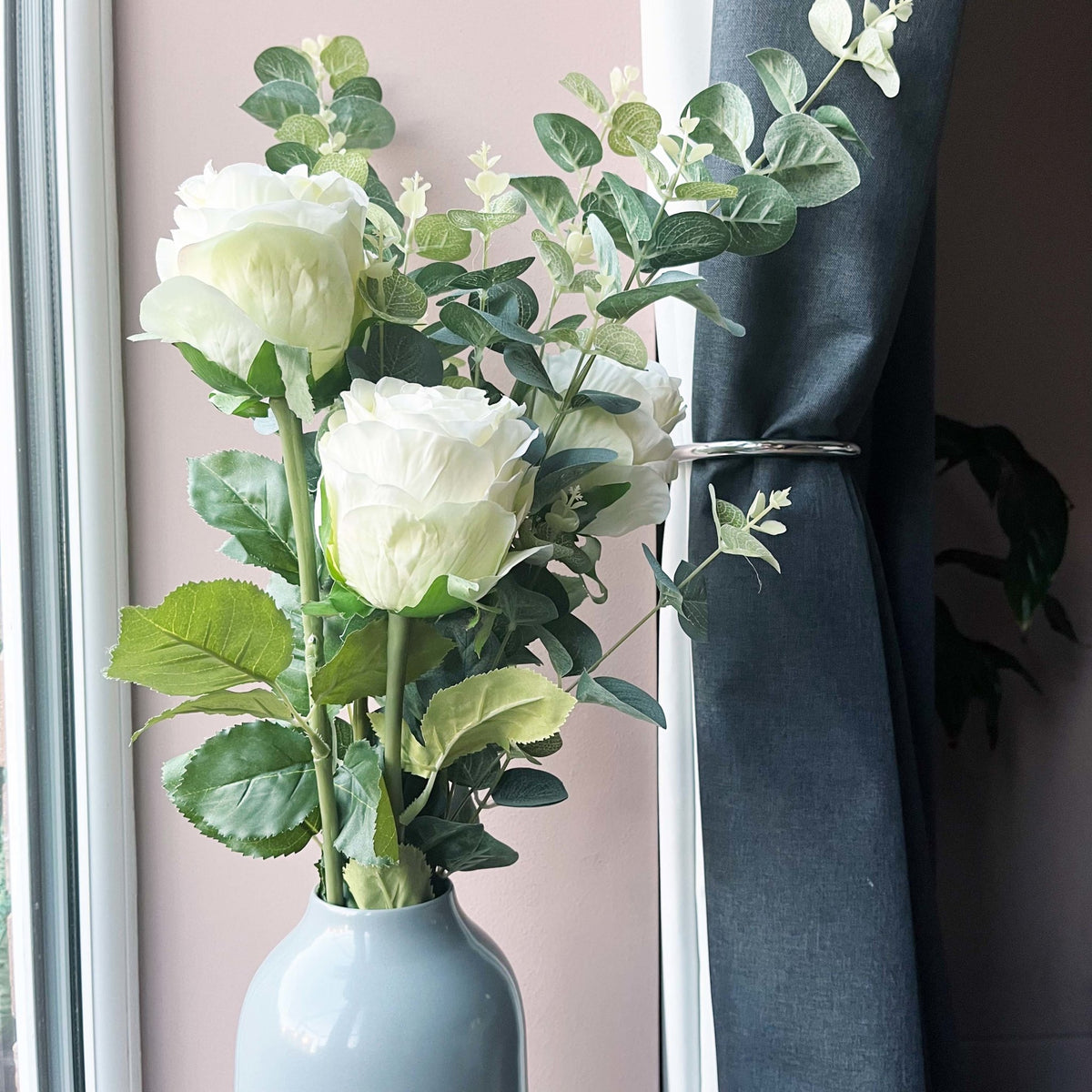 Traditional White Roses in grey vase. 