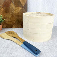 Two-Tier Bamboo Steamer with chopping board and bamboo utensils