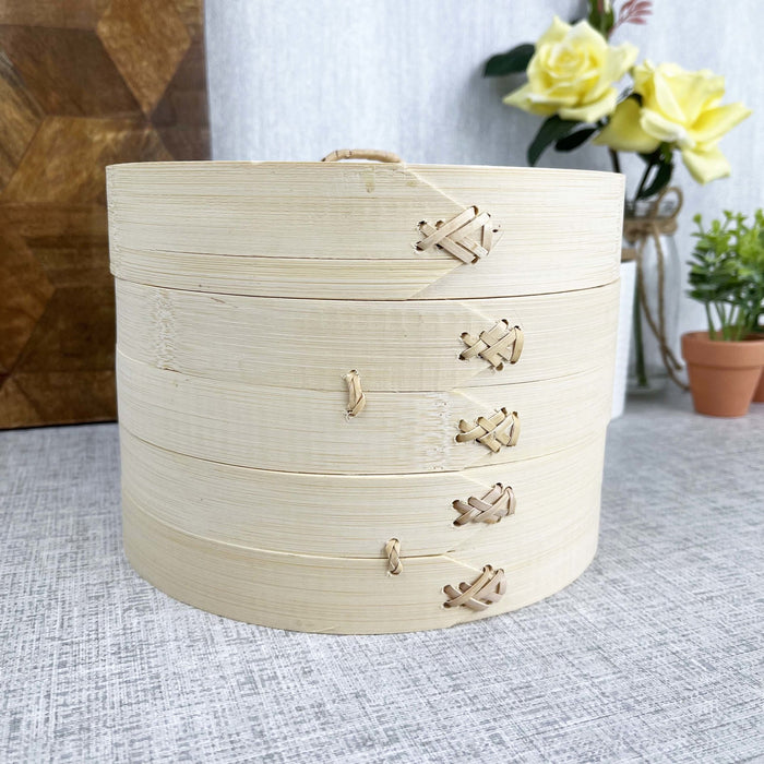 Two-Tier Bamboo Steamer with flowers in background