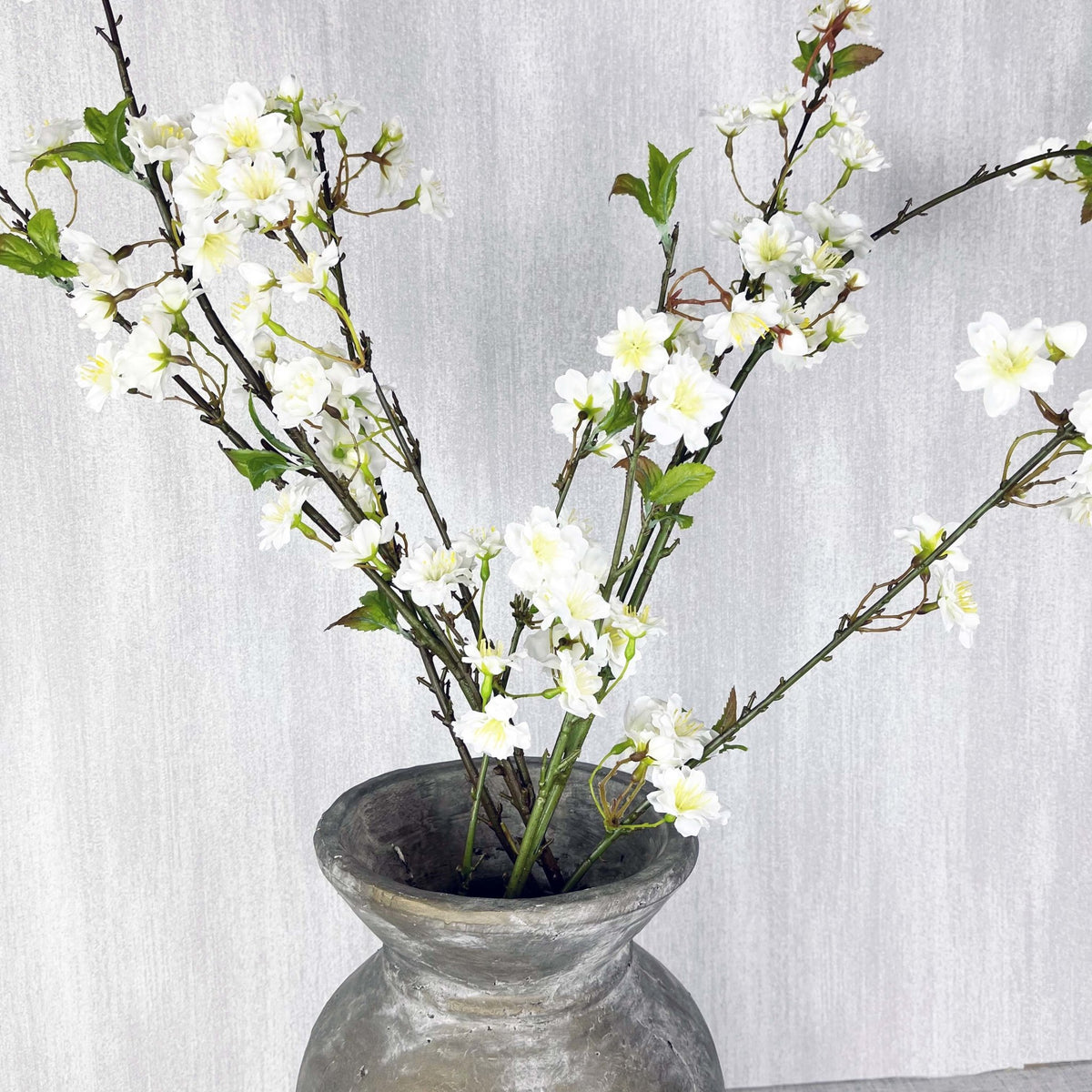 White Cherry Blossom Spray in antique vase